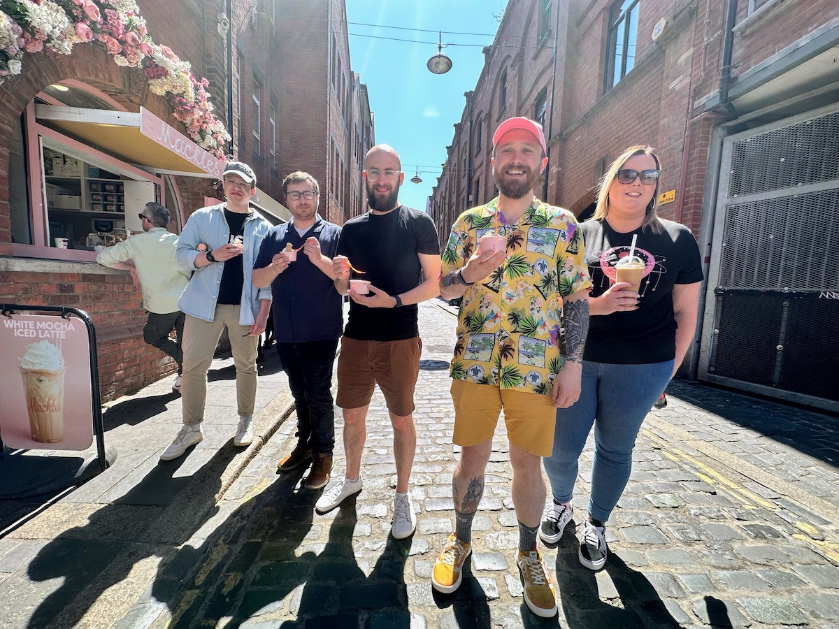 Five adults standing in a sunny street holding ice creams and iced drinks. Four of the people work for Niice and one of them is Toby who works for tosbourn ltd.