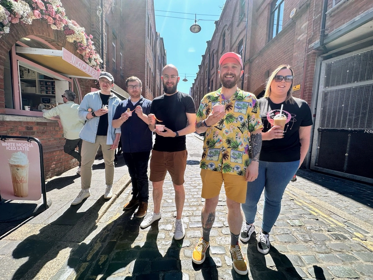 Five adults standing in a sunny street holding ice creams and iced drinks. Four of the people work for Niice and one of them is Toby who works for Tosbourn Ltd.